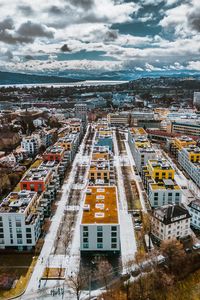 Preview wallpaper city, buildings, aerial view, snow, winter, cityscape