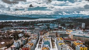 Preview wallpaper city, buildings, aerial view, snow, winter, cityscape