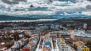 Preview wallpaper city, buildings, aerial view, snow, winter, cityscape