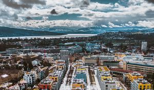 Preview wallpaper city, buildings, aerial view, snow, winter, cityscape