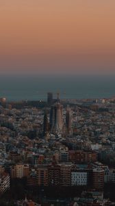 Preview wallpaper city, buildings, aerial view, cityscape, sea, twilight