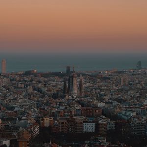 Preview wallpaper city, buildings, aerial view, cityscape, sea, twilight