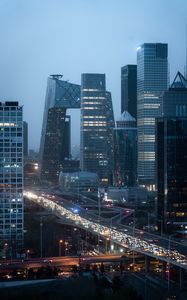 Preview wallpaper city, buildings, aerial view, road, lights, twilight