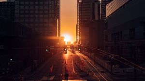 Preview wallpaper city, buildings, aerial view, road, sunset