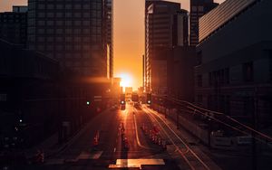 Preview wallpaper city, buildings, aerial view, road, sunset