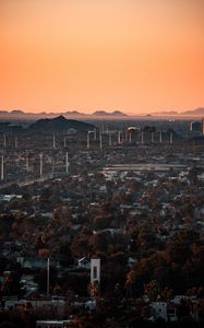 Preview wallpaper city, buildings, aerial view, cityscape, trees, twilight