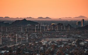 Preview wallpaper city, buildings, aerial view, cityscape, trees, twilight