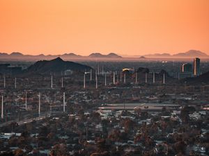 Preview wallpaper city, buildings, aerial view, cityscape, trees, twilight