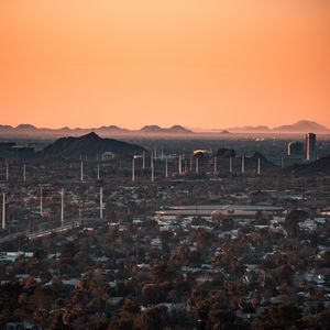 Preview wallpaper city, buildings, aerial view, cityscape, trees, twilight