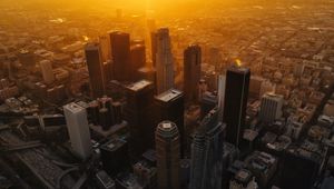 Preview wallpaper city, buildings, aerial view, sunset