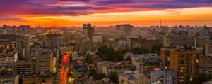 Preview wallpaper city, buildings, aerial view, road, sunset, purple