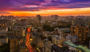 Preview wallpaper city, buildings, aerial view, road, sunset, purple