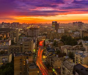 Preview wallpaper city, buildings, aerial view, road, sunset, purple