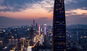 Preview wallpaper city, buildings, aerial view, lights, metropolis, twilight