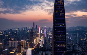 Preview wallpaper city, buildings, aerial view, lights, metropolis, twilight