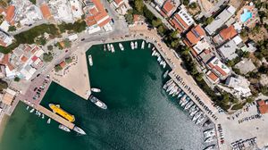 Preview wallpaper city, buildings, aerial view, pier, boats, water