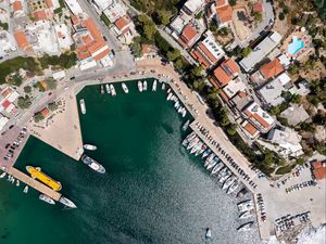 Preview wallpaper city, buildings, aerial view, pier, boats, water