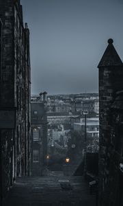 Preview wallpaper city, buildings, architecture, gray, fog, dusk
