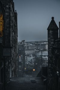 Preview wallpaper city, buildings, architecture, gray, fog, dusk