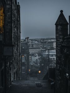 Preview wallpaper city, buildings, architecture, gray, fog, dusk