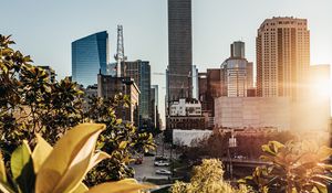 Preview wallpaper city, buildings, architecture, trees, sunlight