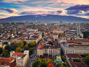 Preview wallpaper city, buildings, architecture, roofs, mountains