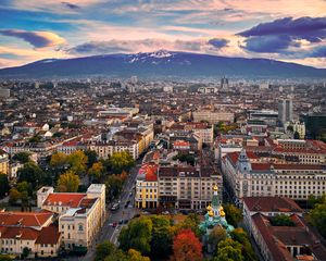 Preview wallpaper city, buildings, architecture, roofs, mountains