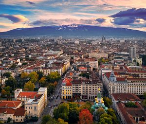 Preview wallpaper city, buildings, architecture, roofs, mountains