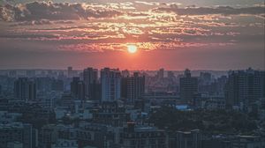 Preview wallpaper city, buildings, architecture, sunset, dusk