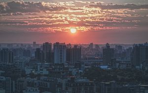 Preview wallpaper city, buildings, architecture, sunset, dusk