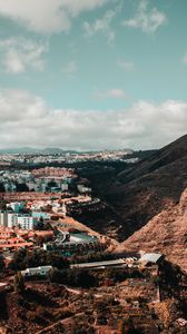 Preview wallpaper city, buildings, architecture, rocks, slope