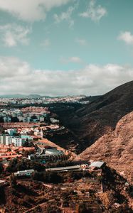 Preview wallpaper city, buildings, architecture, rocks, slope