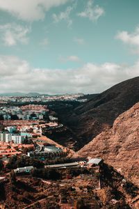 Preview wallpaper city, buildings, architecture, rocks, slope