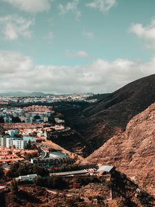 Preview wallpaper city, buildings, architecture, rocks, slope