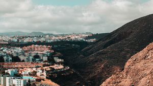 Preview wallpaper city, buildings, architecture, rocks, slope