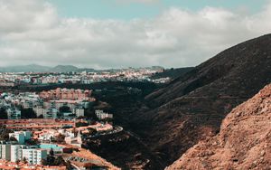 Preview wallpaper city, buildings, architecture, rocks, slope