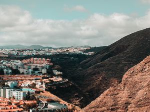 Preview wallpaper city, buildings, architecture, rocks, slope