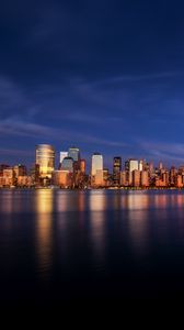 Preview wallpaper city, buildings, architecture, coast, reflection