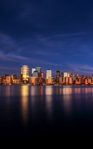 Preview wallpaper city, buildings, architecture, coast, reflection