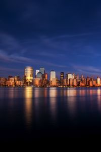 Preview wallpaper city, buildings, architecture, coast, reflection