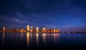 Preview wallpaper city, buildings, architecture, coast, reflection