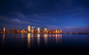 Preview wallpaper city, buildings, architecture, coast, reflection
