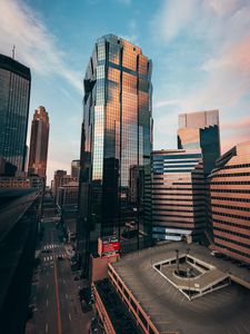 Preview wallpaper city, buildings, architecture, road, cars, sky