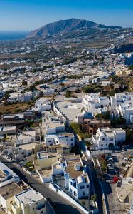 Preview wallpaper city, buildings, architecture, mountains, roofs