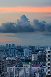 Preview wallpaper city, buildings, architecture, skyscraper, clouds, sunset