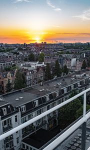 Preview wallpaper city, buildings, architecture, apartments, sunset