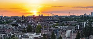Preview wallpaper city, buildings, architecture, apartments, sunset