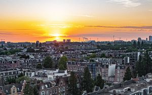 Preview wallpaper city, buildings, architecture, apartments, sunset