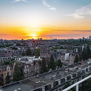 Preview wallpaper city, buildings, architecture, apartments, sunset