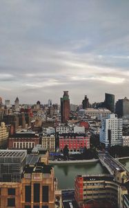 Preview wallpaper city, buildings, architecture, tower, roofs